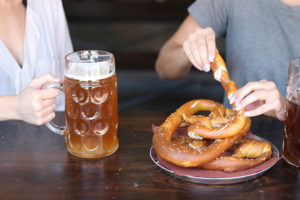stein and pretzel and people
