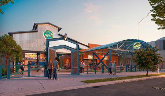 Outdoor beer garden entrance with string lights and seating area